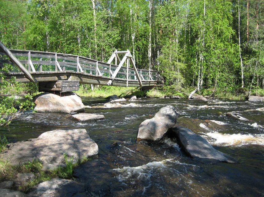 From Rovaniemi: Vikaköngäs Forest Hiking Tour - What the Vikaköngäs hike feels like: forest paths, rocky gorges, and lake views