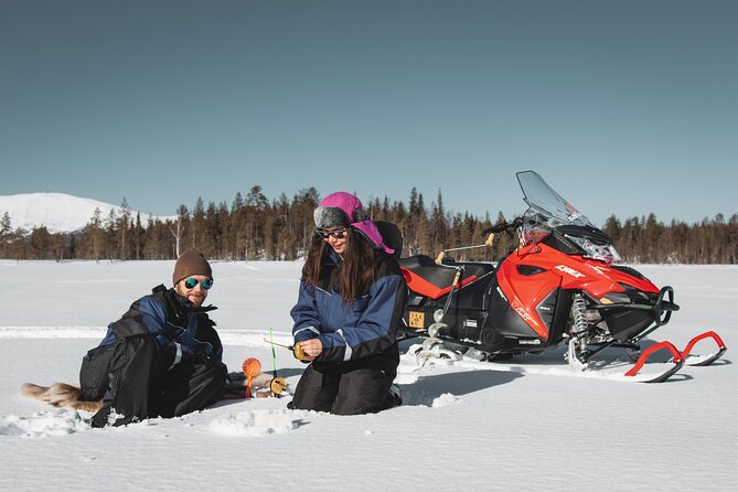 Lappish Lunch Break -Snowmobiling, ice fishing and tasty food - Snowmobiling through frozen rivers and tundra-like country