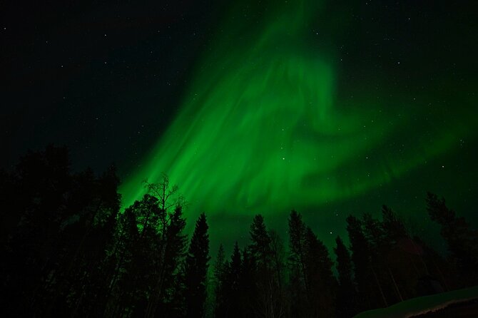 Northern Lights Hunting in Lappish old cottage - How the guide helps you spot faint auroras