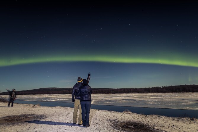 Northern lights hunting photo tour with bbq; small groups - Leaving bright lights behind: what the guide is really trying to do