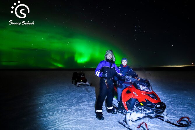 Searching Aurora with Snowmobile - The frozen lake stop and the campfire break